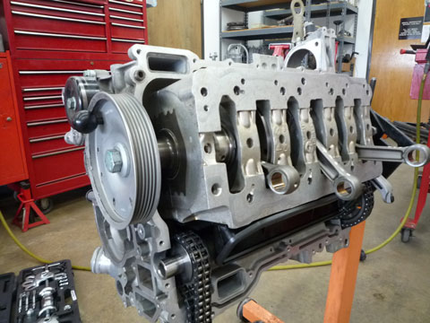 Image of Porsche motor engine being rebuilt.
